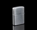Silver metal lighter  on a black background Royalty Free Stock Photo