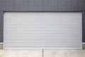 Silver metal roller shutter doors on the ground floor of the house Royalty Free Stock Photo