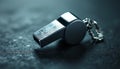 Silver metal whistle on a plain background, sports theme Royalty Free Stock Photo