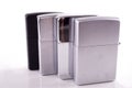 Silver metal zippo lighters on white Royalty Free Stock Photo