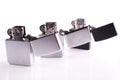 Silver metal zippo lighters on white Royalty Free Stock Photo