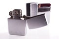 Silver metal zippo lighters on white Royalty Free Stock Photo