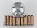 Silver Metallic Piggy Bank With Wrapped Coins Royalty Free Stock Photo