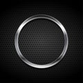 Silver metallic ring on black perforated background