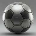 Silver metallic soccer ball with a glossy finish, featuring pentagonal and hexagonal Royalty Free Stock Photo