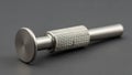 Silver metallic tool with a cylindrical shape and a threaded grip section Royalty Free Stock Photo