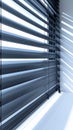 Silver Metallic Venetian Blinds with Sunlight Streaming through Closed Slats Royalty Free Stock Photo