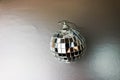 Silver mirror music club disco ball xmas festive Christmas ball, Christmas toy plastered on sparkles black and white background Royalty Free Stock Photo