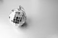 Silver mirror music club disco ball xmas festive Christmas ball, Christmas toy plastered on sparkles black and white background Royalty Free Stock Photo