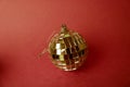 Silver mirror musical club disco ball xmas festive Christmas ball, Christmas toy plastered on sparkles on a red purple background Royalty Free Stock Photo