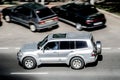 Silver Mitsubishi Pajero SUV car on the city road. Fast moving vehicle on Moscow streets. Offroad 4x4 auto. Compliance with speed Royalty Free Stock Photo