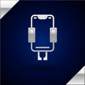 Silver Mobile phone holder icon isolated on dark blue background. Vector