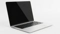 A silver modern laptop computer with a black keyboard and screen displayed against a clean white background. isolated on white Royalty Free Stock Photo