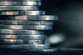 Silver money coin stacking on dark background