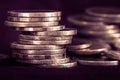 silver money coin stacking on dark background