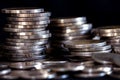 silver money coin stacking on dark background