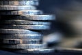 Silver money coin stacking on dark background