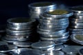 Silver money coin stacking on dark background