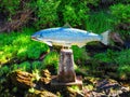 Silver mosiac salmon statue in Ketchikan