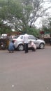 A silver Motorcar repairing on the main road, Solapur, Maharashtra