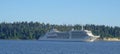 Silver Muse cruise ship from Silversea Cruises ultra-luxury cruise line past the famous Stanley Park in Vancouver Royalty Free Stock Photo