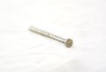 Silver nail on white background. Royalty Free Stock Photo