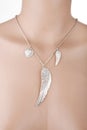 Silver necklace with angel wing and heart