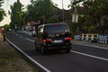 Silver Nissan evalia or NV200 van on the road at afternoon