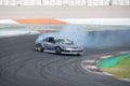 Silver Nissan Silvia S13 5 drifting on a race track