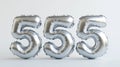 Silver number 555 balloons against neutral background Royalty Free Stock Photo