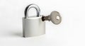 A silver padlock and key are displayed against a white background. The padlock Royalty Free Stock Photo
