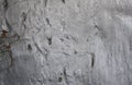 Silver-painted textured surface with grooves, cracks and scratches. Royalty Free Stock Photo