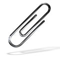 Silver paper clip isolated over white Royalty Free Stock Photo