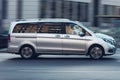 Silver passenger van Mercedes-Benz W447 Viano in the city street in motion. Luxury fast Mercedes Vito van