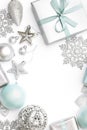 Silver and pastel blue christmas gifts, ornaments and decorations isolated on white background. Christmas border. Royalty Free Stock Photo