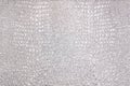 Silver, pearl background of the green faux python skin snakes, crocodile, trend