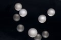 Silver pearl balls on a black background