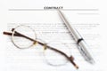 Silver pen and eyeglasses on sales agreement Royalty Free Stock Photo