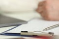 Silver pen lying on opened notebook sheet closeup Royalty Free Stock Photo