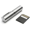 Silver pen shaped device next to a micro sd card Royalty Free Stock Photo
