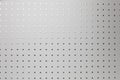 Silver perforated aluminum sheet, background Royalty Free Stock Photo