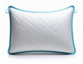 Silver Pillow with Turquoise Trim Against White Background in Studio Lighting Royalty Free Stock Photo