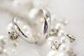 Silver plain wedding rings, pearls and rhinestones Royalty Free Stock Photo