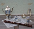 English tea set, metronome for music and a block flute on a sheet of music Royalty Free Stock Photo