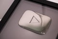 Silver play button award for YouTube creators with 100,000 subscribers