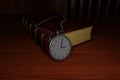 Silver pocket watch and classic book