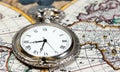 Silver pocket watch over old world map Royalty Free Stock Photo