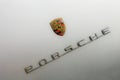 Silver Porsche Spyder Sportscar emblem with copy space