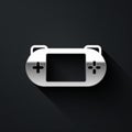 Silver Portable video game console icon isolated on black background. Gamepad sign. Gaming concept. Long shadow style