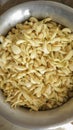 A silver pot full of peeled garlic before blending at home in Dhaka, Bangladesh.